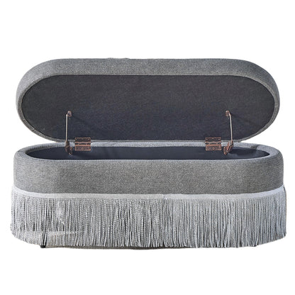 Oval Upholstered Storage Ottoman With Fringe Trim & Lift Top Lid
